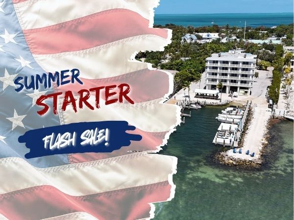 Aerial view of a coastal resort with boats, docks, and white buildings, overlaid by a torn American flag graphic reading &ldquo;Summer Starter&rdquo; and &ldquo;Fresh Swim&rdquo; in bold letters.